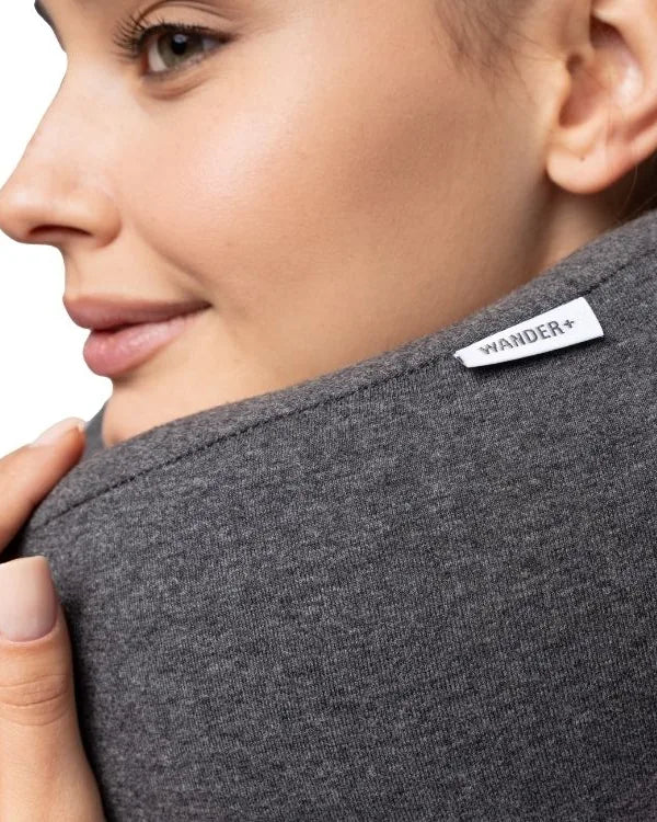 Close-up of the WANDER+ Pillow cover and label worn on the neck