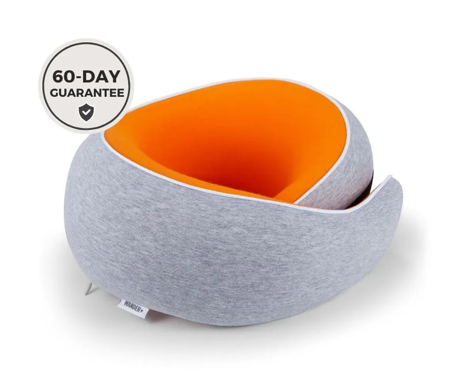 WANDER+ Pillow in Orange, on its own