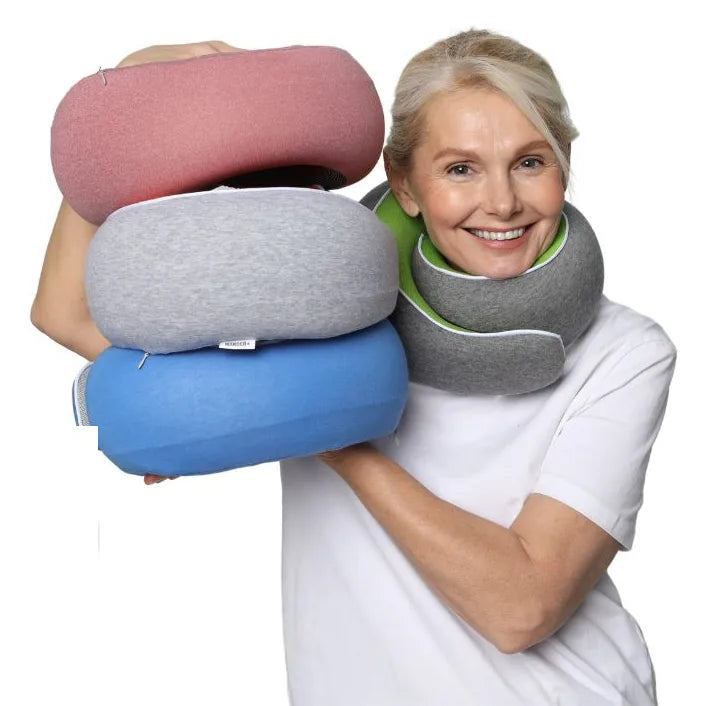 Three WANDER+ Pillows stacked in rose, light grey and blue